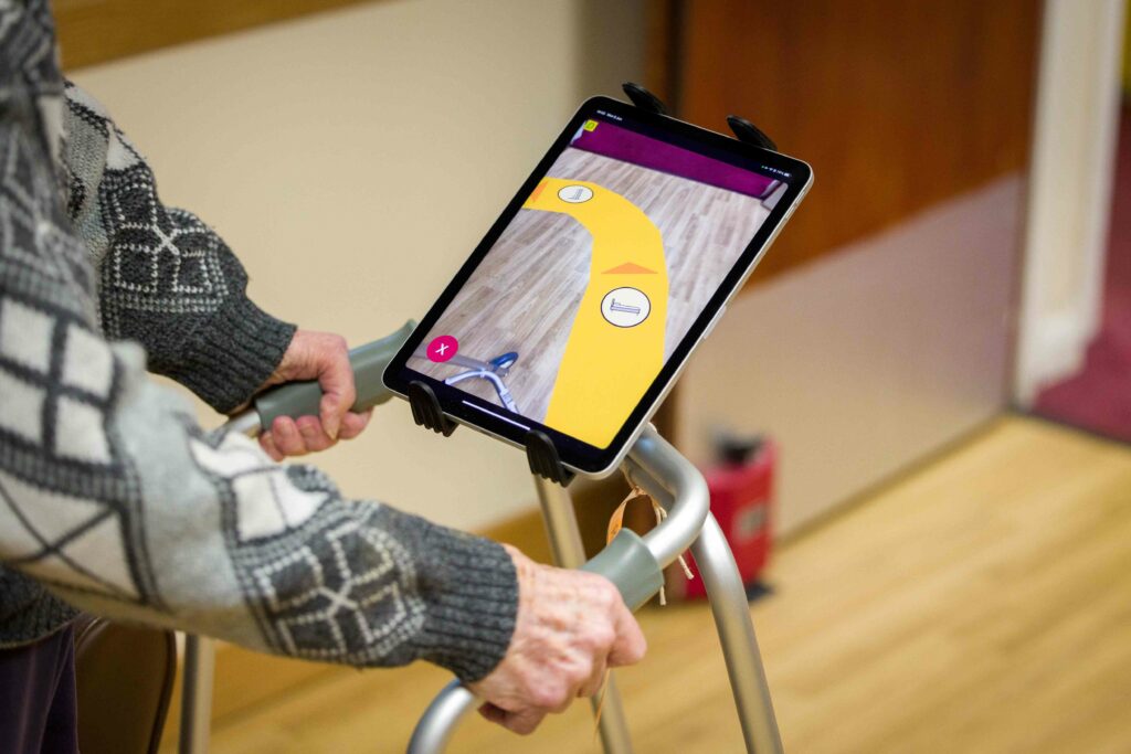 Elderly man using Dorothy app on iPad