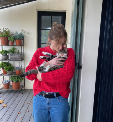 Care City team member Hannah Weir holding her cat