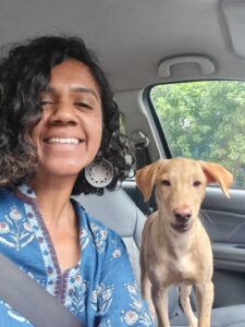Anjali Moorthy and her foster dog friend Dusty